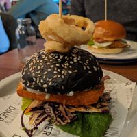 Tofish stack in the front, chickken bruger in the back at Unity Diner in East London