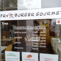 Opening Times and dining room at the front. at Fryburger Gourmet in Bulle