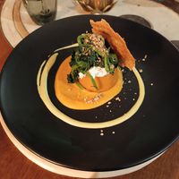 Tortino di carote e patate con ricotta alle mandorle, chips e cime di rapa at Shakti Food in Brescia