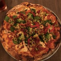 Veggie pizza, made with vegan ricotta and topped with calabria peppers at Firepit in Atlanta