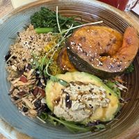 Superbowl Salad: superfood salad of mixed greens, pumpkin, quinoa, broccolini, goji berries & seed mix, served with avocado, house made turmeric, ginger sauerkraut & green tahini   at Nourished in Avalon Beach