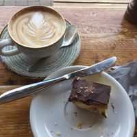 Flat white with oat milk, vegan millionaire’s shortbread (what’s left of it ?) at Coffee & Drift in Lymington