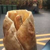 Vegan fish and chips wrap with sauce  at Pyramid Vegan Cafe & Bakery in Glastonbury