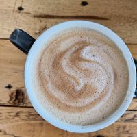 Latte with oat milk at Pyramid Vegan Cafe & Bakery in Glastonbury
