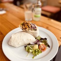 Vegan kebab with marinated soya protein, humous, slaw, jalapeños and some other goodness I can’t remember. Delicious!  at Pyramid Vegan Cafe & Bakery in Glastonbury