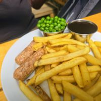 Sausage, chips, peas & gravy at Pyramid Vegan Cafe & Bakery in Glastonbury