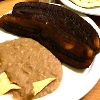 Sweet fried plantains with refried beans and corn chips. at Fernanda's Salvadorian in Cathedral City
