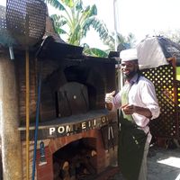 Stephen and the oven at Lion's Share Cafe in Bridgetown