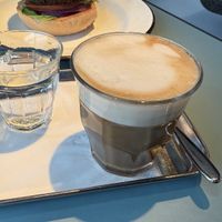 Oat latte with felafel burger in the backgroundd  at HKG - Beef & Liberty Burgers - T1 in Outlying Islands