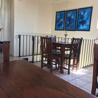 Bright beautiful art adorns the walls at La Media Naranja in San Miguel De Allende