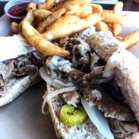 Philly Cheesesteak with Seasoned Fries at Vegetarian Restaurant by Hakin in North Miami Beach