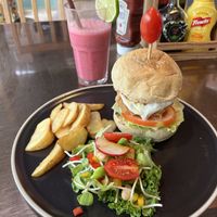Chikn burger with dragonfruit juicee  at The Vegan Table in Phuket
