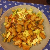 Salad with vegan cheese and a patty at Iron Duke in Aveiro