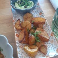 Potatoes with spring onion yoghurt dip at Bistro Papu ja Pata in Tampere