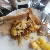 Galette vincennes: Potatoes, onions, vegan sausages, mango chutney (swapped mango chutney for garlic sauce). at Coffee Crepes in Paris