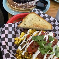 Tofu scramble in front, pancakes in the back  at Fern Cafe and Bakery in Victoria