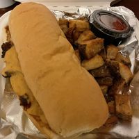 Mushroom philly take out with home fries at Irregardless Cafe in Raleigh