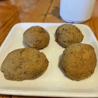 Complimentary scones… not very scone-like but vegan and complimentary so not gonna complain    at Irregardless Cafe in Raleigh
