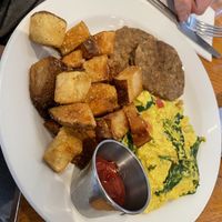 Tofu soup, err, I mean scramble. 😔 home fries were good, veggie sausage bland    at Irregardless Cafe in Raleigh