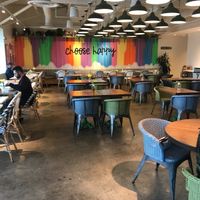 Fun inviting colors and seating at Flower Child in Atlanta