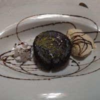 Vegan hot chocolate cake with ice cream and cream at Ristorante Gourmet in Elche