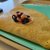Savory vegan crepe stuffed with seasoned tofu, pesto, veggies and cheez at Dulce Crepes in Fairfax