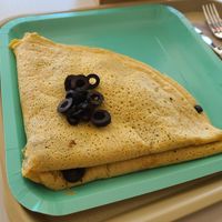 Savory vegan crepe stuffed with mushrooms, cheez, olives and a smoky fake meat at Dulce Crepes in Fairfax