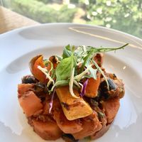 Carrot Aubergine Puttanesca with butternut wedges  at Eat Well Restaurant in Dubai