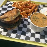 Nashville hot chicken sandwich, cheesy grits, and fries  at V-Grits and Chimera Brewing in Louisville