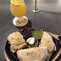 Brunchwrap supreme with biscuit and mimosa at V-Grits and Chimera Brewing in Louisville