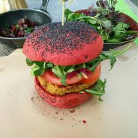 Holi burger with side salad and roasted beets at Veganapati in Lisbon