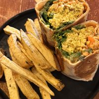 Scrambled tofu, sausages and carrots inside a burrito   at Apuro Vegan Bar in Porto