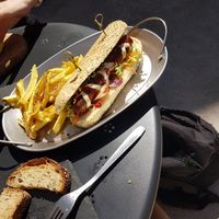 Hotdog and chips at Apuro Vegan Bar in Porto