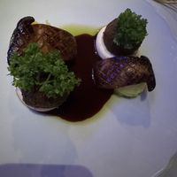 Oyster mushrooms on mashed potatoes with falafels on a medallion of vegan cream  at Klaus K in Helsinki