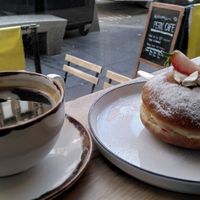 "Royal Sandwich" vegan doughnut and an americano at Perk Cafe in Inverness