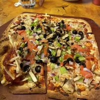 Thin crust pizza with vegan cheese.   at Creative Cafe in Casa Grande