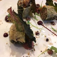Roasted and pickled veggies in cabbage rolls with crispy kale at L'Orygine in Quebec
