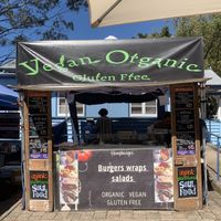 Menu on side includes salads, wraps and burgers  at Hempburger - Market Stall in Eumundi