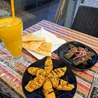Mango juice, kibbeh, stuffed vine leaves, flat bread at Abou Tayssir in Tangier