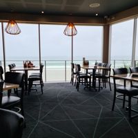 From the inside,  pleasant seating with view at Coolum Surf Club in Coolum Beach