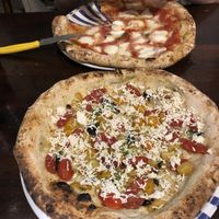 umberto (vegana) pizza pictured closest   at Gino e Toto Sorbillo in Naples