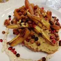 Maple roasted seasonal veg, pine nuts, pomegranate seeds and chickpeas on top of hummus and toast at Rawnchy in Glasgow