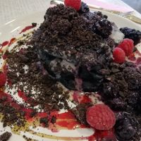 Black spooky pancakes, berries, Oreos, cream at Rawnchy in Glasgow