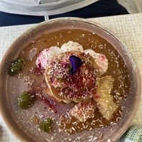 Pancakes with maple syrup, coconut, pineapple, amaranth  at Rawnchy in Glasgow