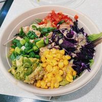 Bowl with quinoa, tofu, tomato, corn, lettuce, scallions, avocado, and vinaigrette. Bland, but will get the job done. at IAH - freshii - TB in Houston