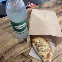 Agua con gas & vegan empanada  at Volver in Girona