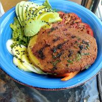Poke Bowl with giant seitán patty on top at Prana Vegan in Arequipa