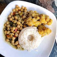 My set menu main - “legume stew of the day + cauliflower wings”. The chickpeas were cold but otherwise everything was tasty! (Cauli wings a bit of a random combo.)  at Prana Vegan in Arequipa