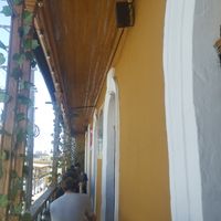 Cute little balcony with tables at Prana Vegan in Arequipa