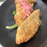 Vegetable empanadillas are a must get.   at Cafe Berlin in San Juan
